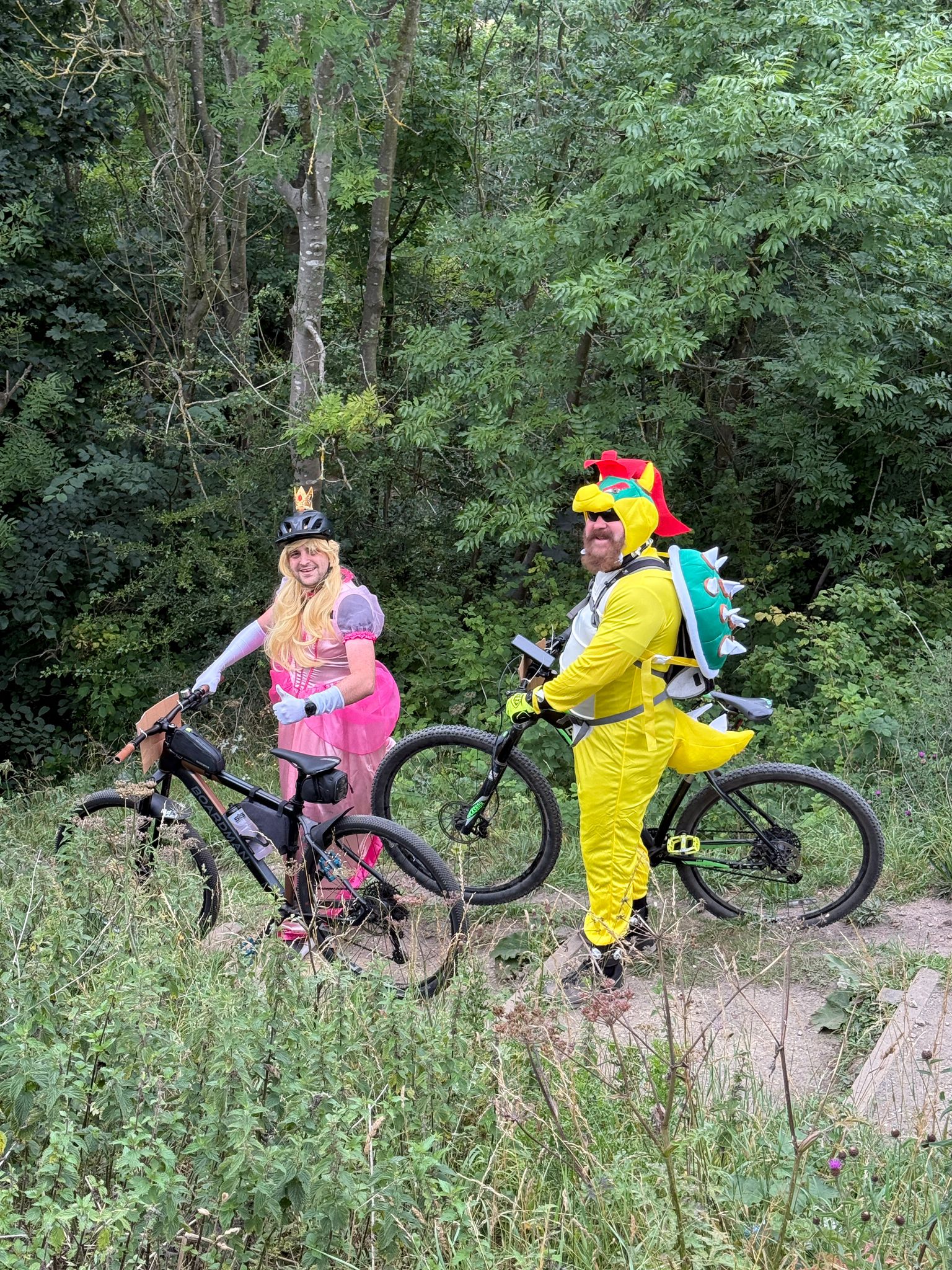 Matthew on a bike dressed as princess peach