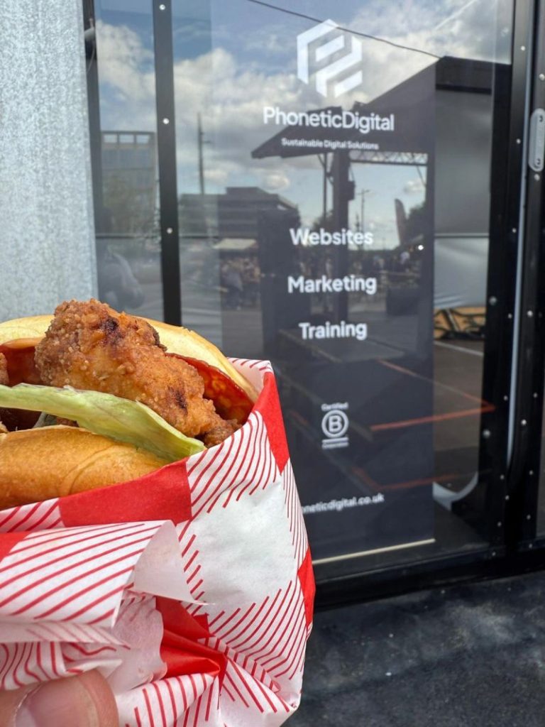 Burger in front of our banner at a food festival
