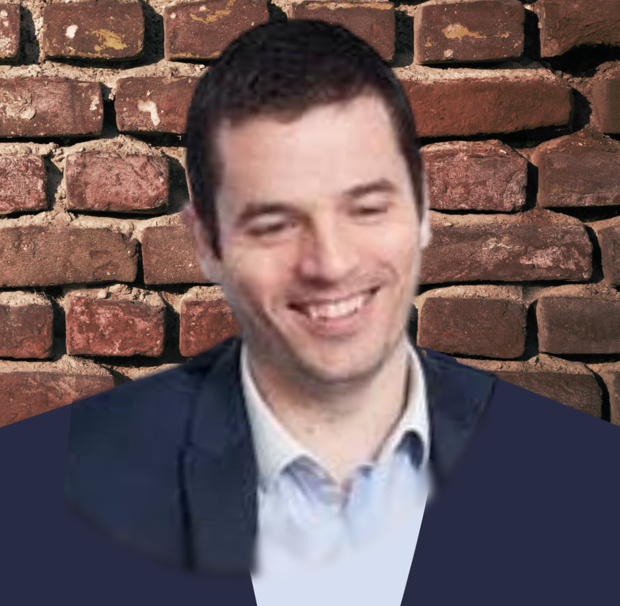 James in front of a brick wall